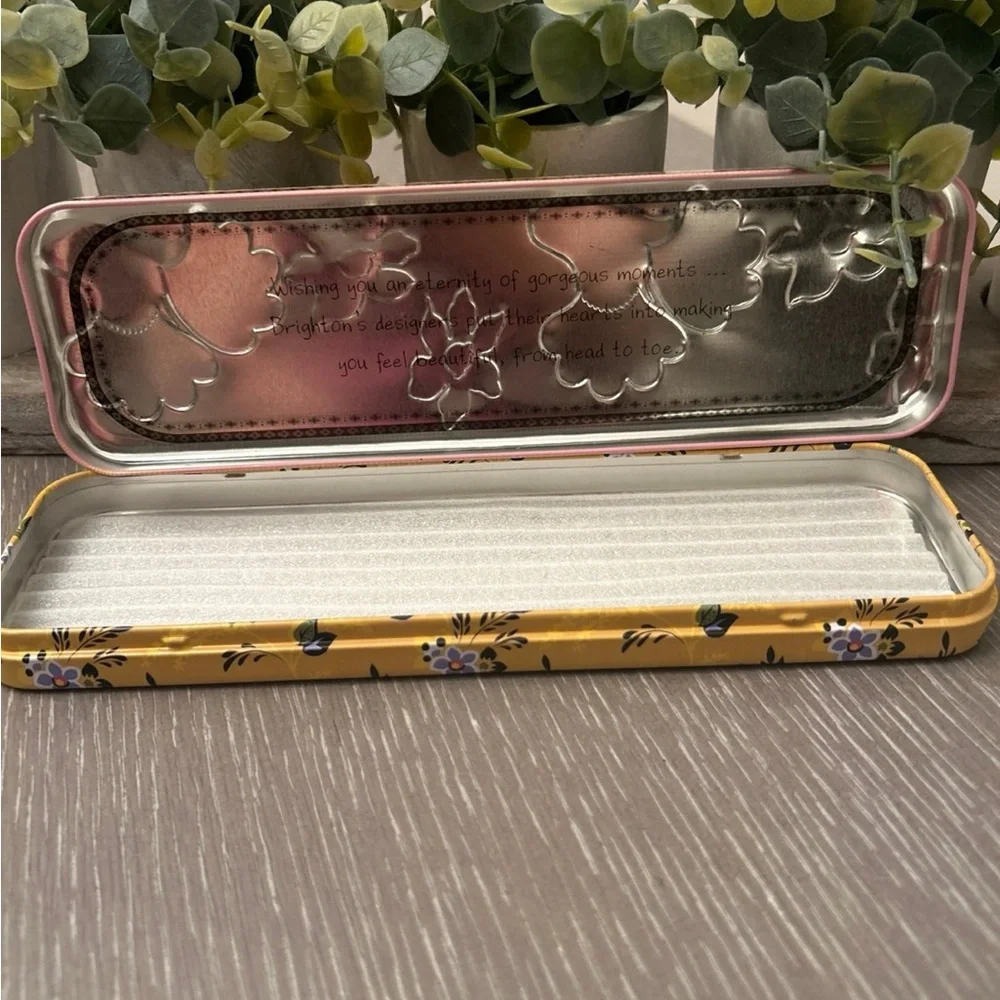 Brighton watch‎ tin with a pink floral design